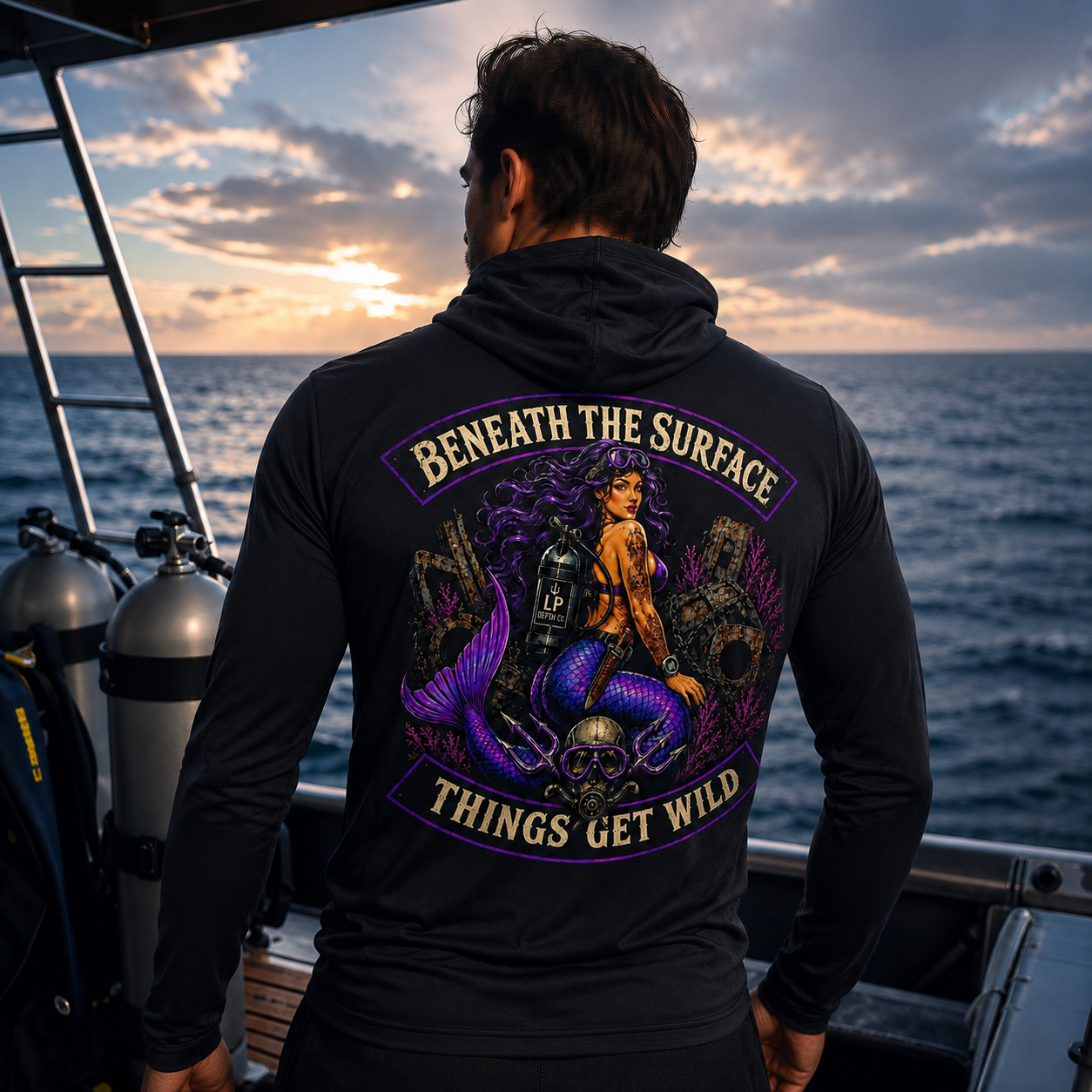 Beneath the Surface hoodie artwork on a diver at sunset